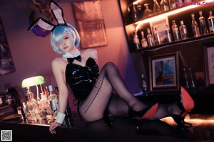 A woman in a bunny costume posing for a picture.