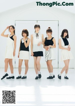 A group of four young women posing for a magazine.