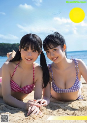 A couple of young women standing next to each other.